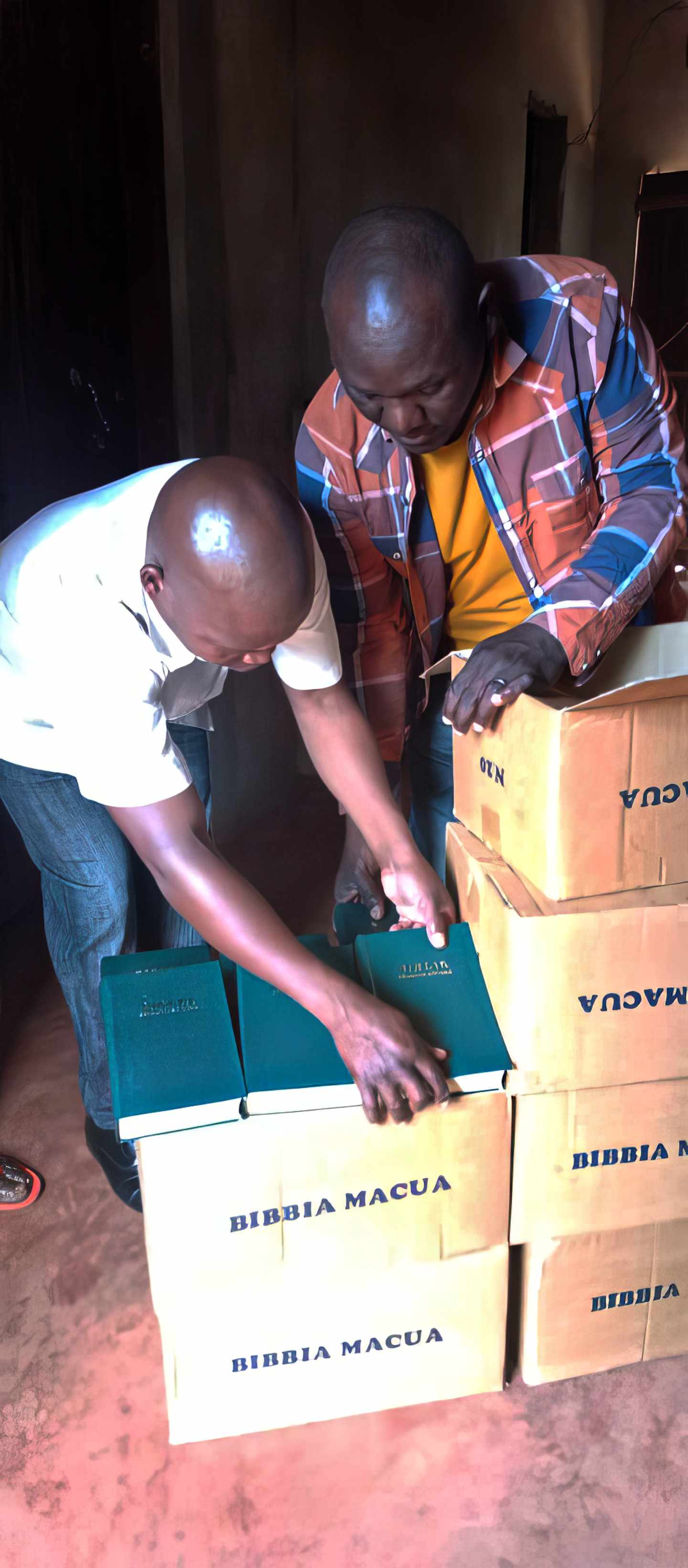 Unpacking boxes of Macua-language Bibles for distribution in Mozambique