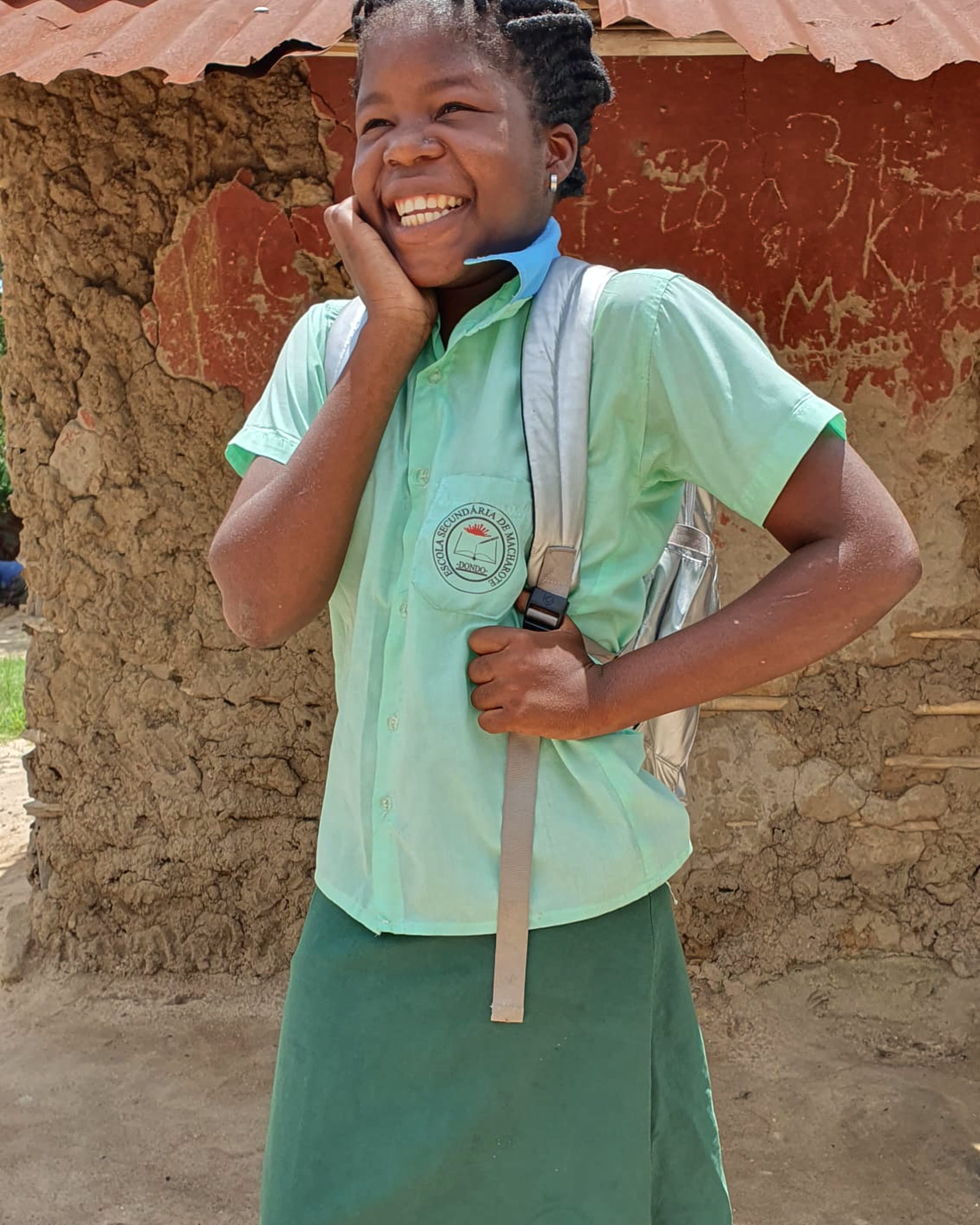 One of our girls - thrilled to be heading to school with her new uniform and backpack.