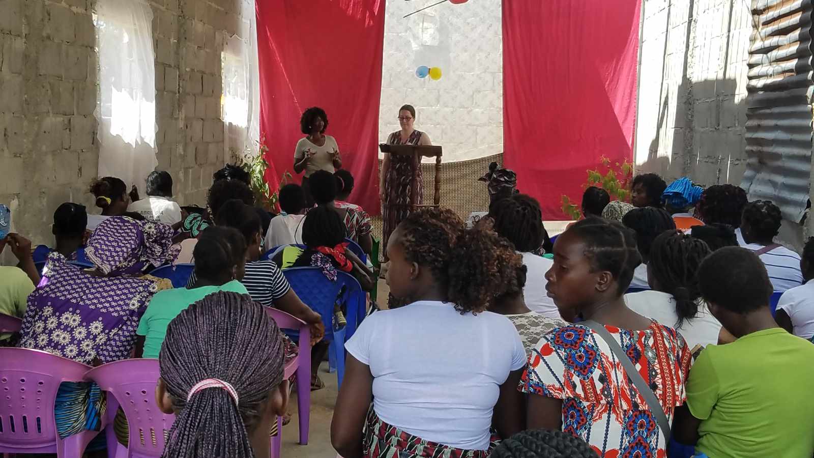 Susan speaking to a room full of women at a church gathering in Mozambique